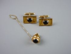 A PAIR OF BOXED, BELIEVED GOLD EASTERN CUFFLINKS of oblong bark form with centre cabochon sapphire