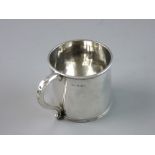 A SILVER DRINKING CUP with banded rims and scroll handle, 7 cms high, 7 cms diameter, Birmingham