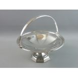 A CIRCULAR SILVER TAZZA on an octagonal pedestal base and having a triple lined border with swing