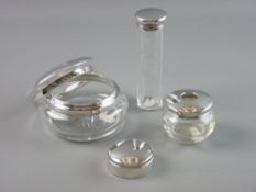 FOUR SILVER DRESSING TABLE ITEMS to include a silver rimmed glass powder bowl and cover, two further