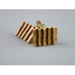 A PAIR OF NINE CARAT GOLD BARK-EFFECT OBLONG CUFFLINKS, boxed, 10 grms