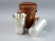 A PAIR OF SILVER BEAKERS by the Goldsmiths & Silversmiths Company in a leather carry case, London