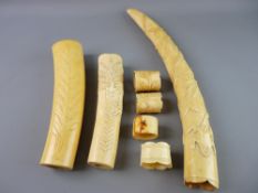 THREE WORKED AFRICAN IVORY TUSKS and four napkin rings, the tusks measuring 15, 25 and 30 cms