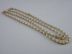 A NINE CARAT GOLD MUFF CHAIN, 70 cms long, 23.9 grms