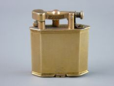 A NINE CARAT GOLD ENGINE TURNED DUNHILL CIGARETTE LIGHTER of oblong form with angled corners, 32