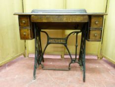 A POLISHED ENCASED SINGER TREADLE SEWING MACHINE with two small drawers at each end