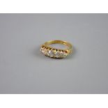 AN EIGHTEEN CARAT GOLD FIVE STONE DIAMOND DRESS RING, visual estimate 1.5 carats total, size 'J',