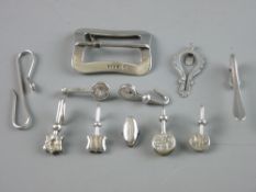 A COLLECTION OF SILVER SKIRT LIFTERS, eight various designs and styles, two white metal lifters