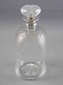 A CUT GLASS DIMPLE SHAPED DECANTER WITH SILVER COLLAR, the body cut with grape and vine leaf