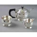 A SILVER THREE PIECE TEASET of plain circular form, London 1933 and 1940, 23 troy ozs