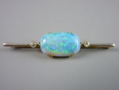 AN EXTREMELY IMPRESSIVE FIFTEEN CARAT GOLD BAR BROOCH having a centre oval opal approximately 23 x