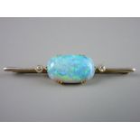 AN EXTREMELY IMPRESSIVE FIFTEEN CARAT GOLD BAR BROOCH having a centre oval opal approximately 23 x