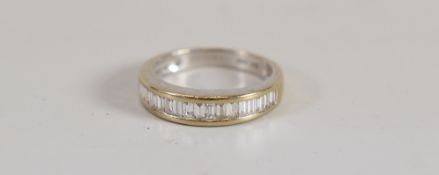 A MODERN HALF-HOOP DIAMOND & 18K WHITE GOLD ETERNITY RING with a single row of baguette diamonds,
