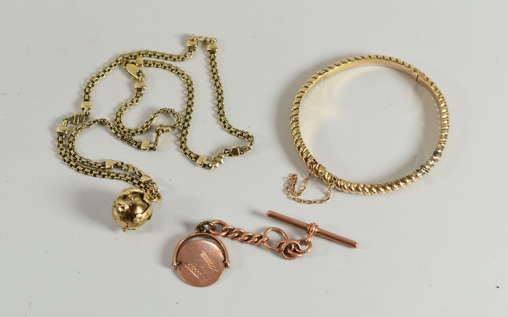 THREE 9CT YELLOW GOLD ITEMS comprising bangle (hallmarked), rose gold swivel pendant and t-bar (