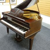 A MONINGTON & WESTON BABY GRAND PIANO in mahogany and having eighty-eight notes, stamped with No.