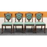 A SET OF FOUR DRAWING ROOM CHAIRS having shield backs with buttoned upholstery and carved rails