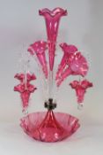 A VICTORIAN CRANBERRY GLASS FANCY EPERGNE having six alternating branches, 56cms high