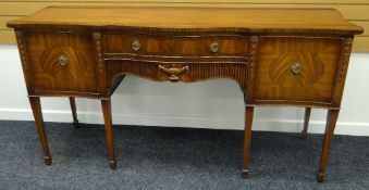 A REPRODUCTION MAHOGANY REGENCY-STYLE SIDEBOARD having a serpentine front with centre drawer and