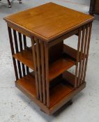 AN EDWARDIAN MAHOGANY ROTATING BOOKCASE