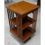 AN EDWARDIAN MAHOGANY ROTATING BOOKCASE