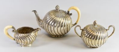A THREE PIECE SILVER CONTINENTAL TEA-SET, believed Polish 800 Standard silver and of fluted swirl