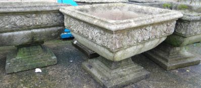 A TRIO OF SANDSTONE GARDEN URNS of square form bases