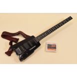 A STEINBERGER ELECTRIC GUITAR in black with carry case, 75cms long