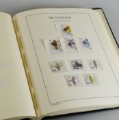 GREEN ALBUM OF COMPREHENSIVELY FILLED GERMAN STAMPS from 1975 onwards and chronologically ordered