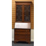 AN EDWARDIAN INLAID MAHOGANY BUREAU BOOKCASE (distressed)