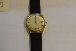 AN OMEGA AUTOMATIC GENTS WRISTWATCH in 9ct gold with non matching leather strap (running at time