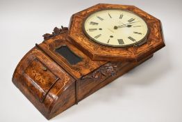 A WALNUT ENCASED EIGHT DAY PENDULUM WALL CLOCK with marquetry decoration and carved oak laurel