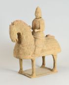 A CHINESE ARCHAIC TERRACOTTA TOMB-HORSEMAN with sgraffito patterned horse and having a incense