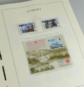 AN ALBUM OF MAINLY GUERNSEY MINT STAMPS and other loose stamps