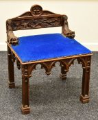 A CONTINENTAL CARVED ECCLESIASTICAL CHAIR with gargoyle creature arms and naturalistic back with