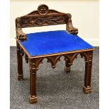 A CONTINENTAL CARVED ECCLESIASTICAL CHAIR with gargoyle creature arms and naturalistic back with