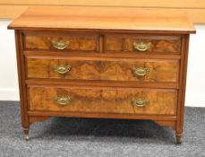 A POLISHED WALNUT BEDROOM CHEST of two long and two short drawers with brass handles