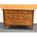 A POLISHED WALNUT BEDROOM CHEST of two long and two short drawers with brass handles