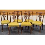 A SET OF SIX CHIPPENDALE-STYLE CHAIRS with stuff over green upholstered seats