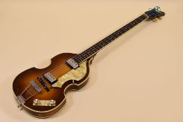 A HOFNER ELECTRIC GUITAR with mother of pearl banding and decoration together with carry case,