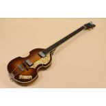 A HOFNER ELECTRIC GUITAR with mother of pearl banding and decoration together with carry case,