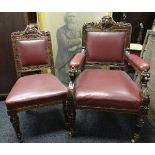 A SET OF TWELVE LIBRARY CHAIRS (10 + 2) in carved oak and buttoned red-leather upholstery