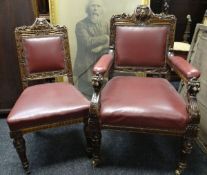 A SET OF TWELVE LIBRARY CHAIRS (10 + 2) in carved oak and buttoned red-leather upholstery
