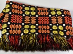 A COLOURFUL WELSH WOOL BLANKET with orange and yellow geometric patterns to black reserve, approx