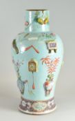 A RARE CHINESE POTTERY VASE of baluster form with narrow neck in turquoise ground and with the