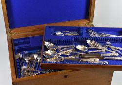 A FOUR-TIER OAK CUTLERY CANTEEN containing a large quantity of mixed EPNS, mainly Queens pattern,