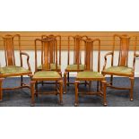 A SET OF SIX OAK DINING CHAIRS four + two with drop in green upholstered