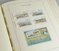 A COMPREHENSIVELY FILLED GREEN ALBUM OF ISLE OF MAN STAMPS AND LOOSE SHEETS professionally completed