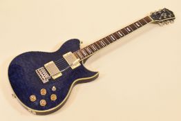 A WASHBURN ELECTRIC GUITAR in blue with carry case, serial number 03010027, 96cms long