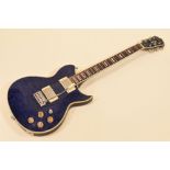 A WASHBURN ELECTRIC GUITAR in blue with carry case, serial number 03010027, 96cms long