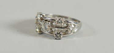 A CONTEMPORARY PLATINUM & MOISSANITE SEVEN STONE RING, 4.3gms